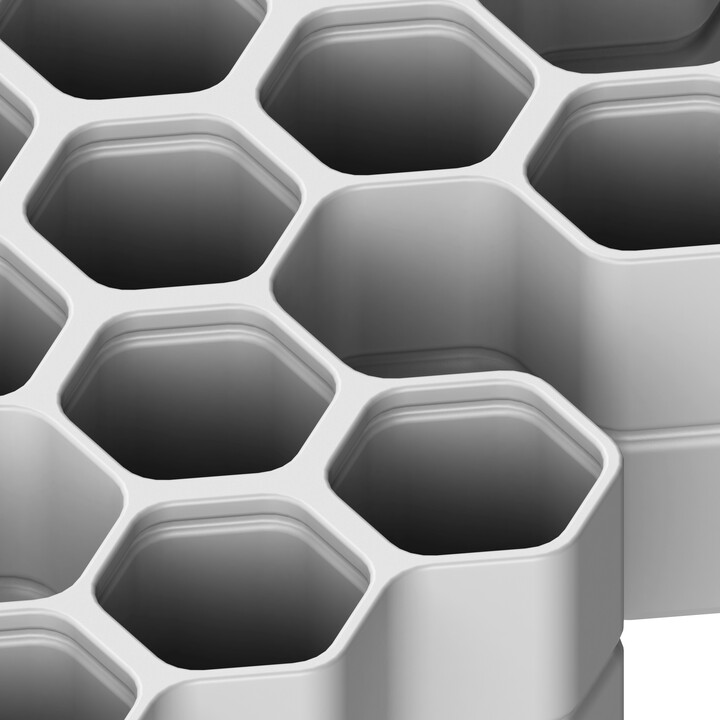 Plastikowy pojemnik do noseworku o kształcie plastra miodu – trwały i łatwy do utrzymania w czystości.
